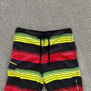 O'Neill Red and Yellow Board Shorts with Athletic Design